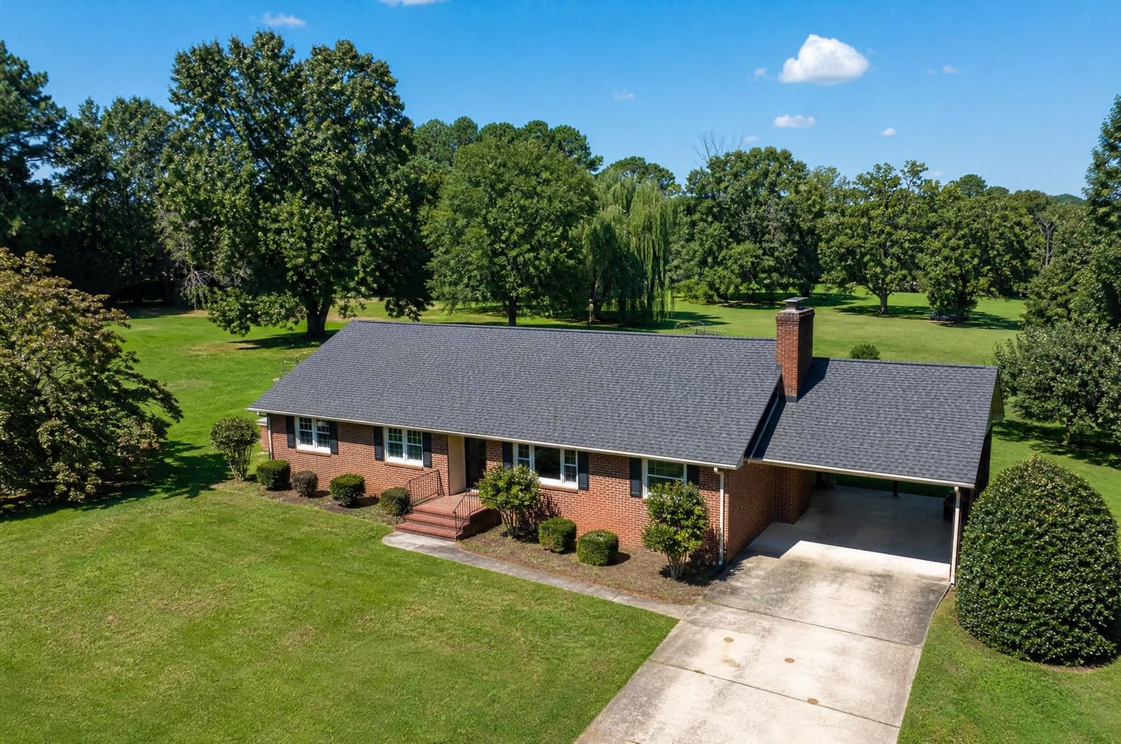 Brick ranch home in Sanford, NC with a new pewter gray shingle roof, aerial view