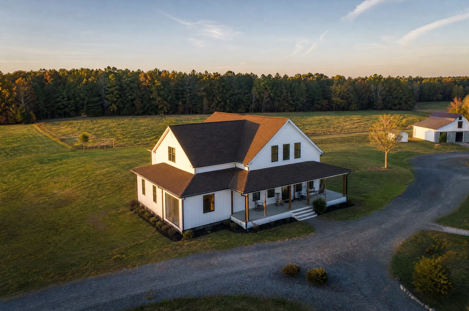 White farmhouse outside Siler City, NC with a new barkwood brown shingle roof, aerial view