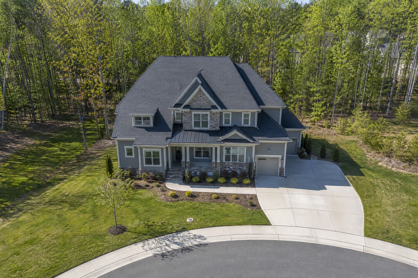 Two-story home in Apex, NC with a new pewter gray architectural shingle roof, aerial view