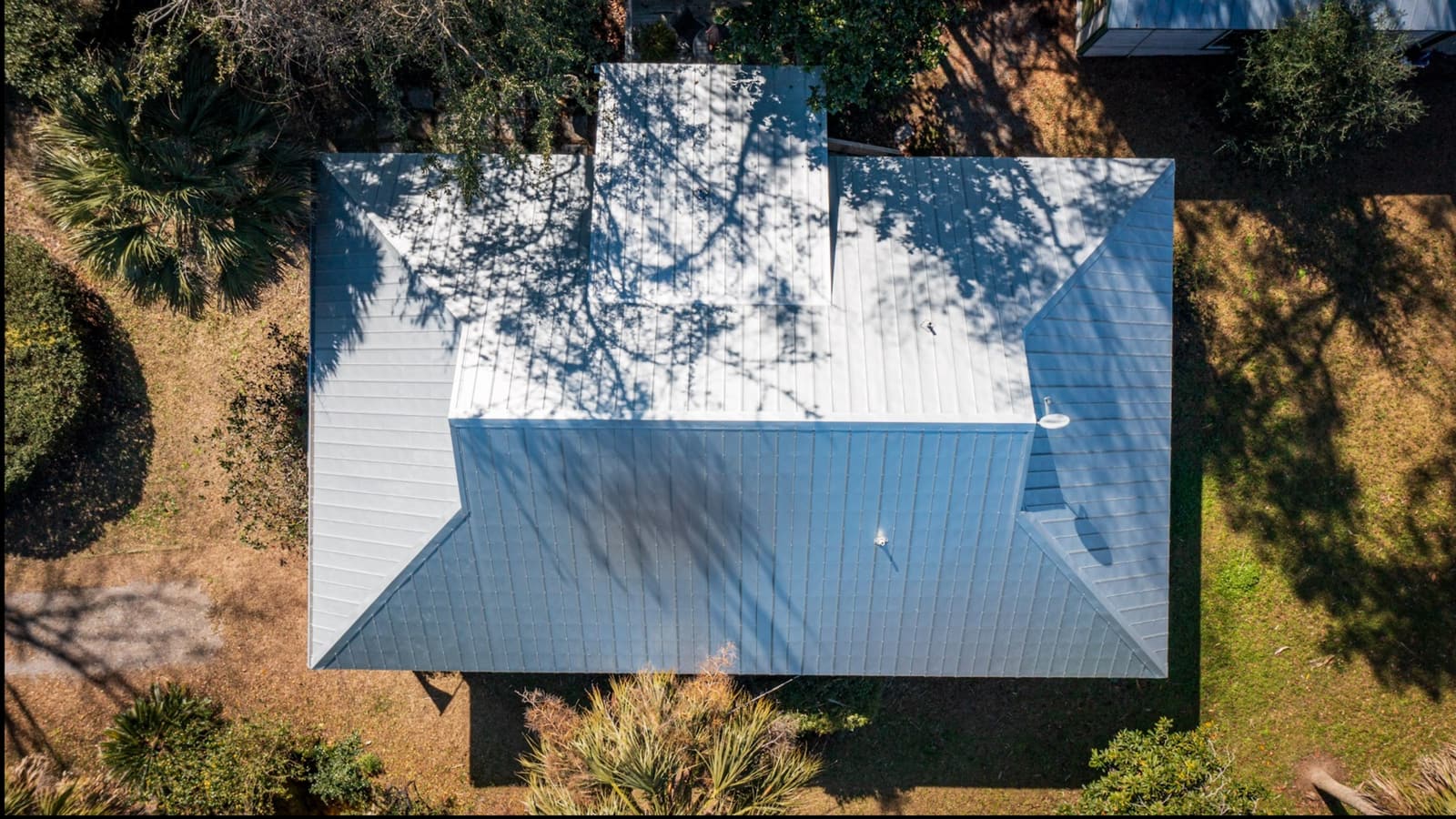 White metal roof installed by Skyline on a farmhouse in Siler City, NC, aerial view
