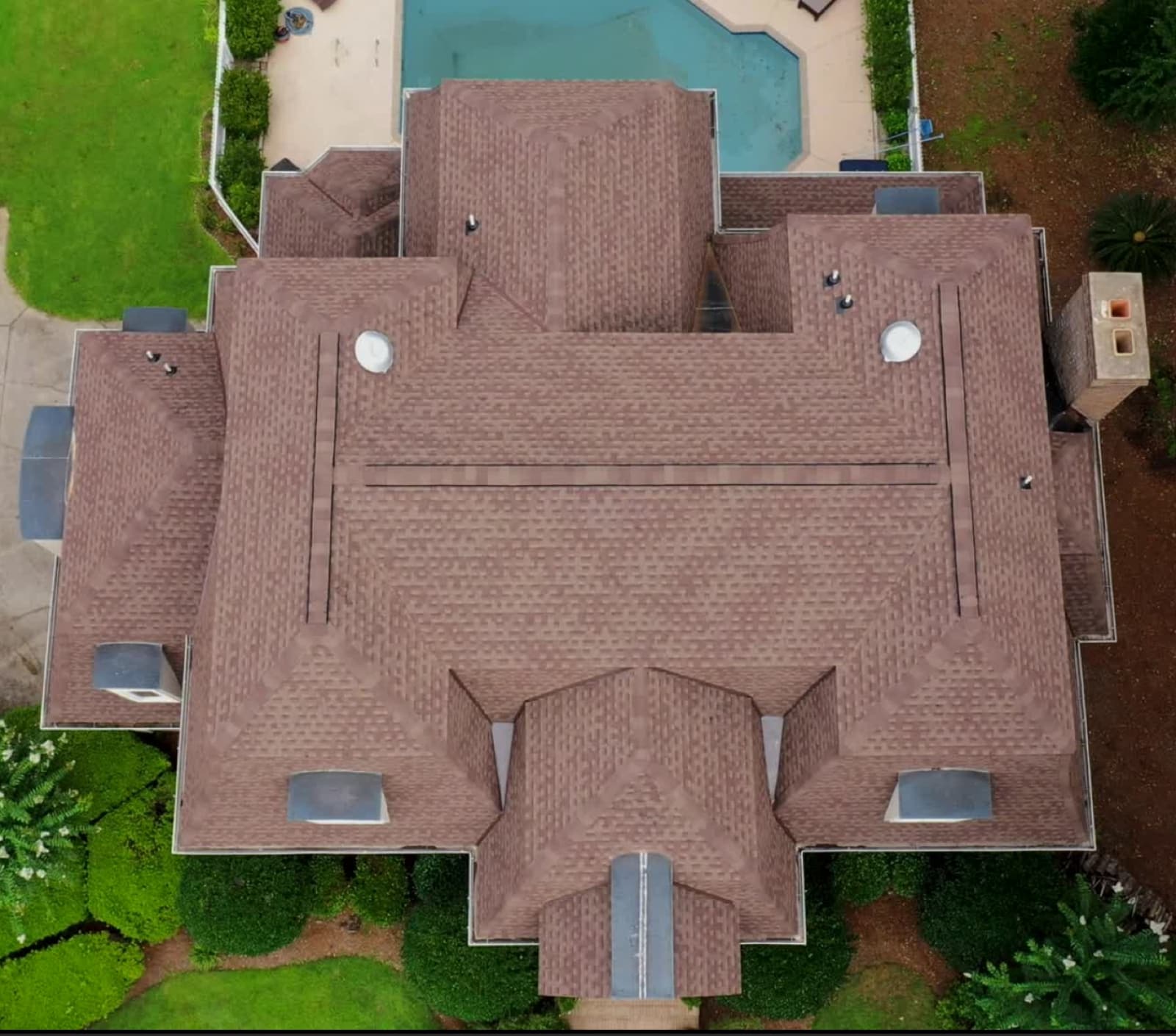 Brown GAF shingle roof replacement by Skyline on a manor home in Apex, NC, straight-down aerial